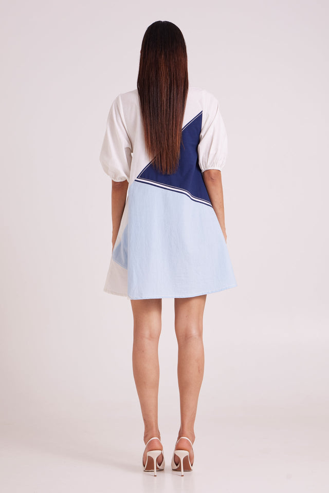 Juno segmented tide short dress full back view with diagonal navy and blue panels