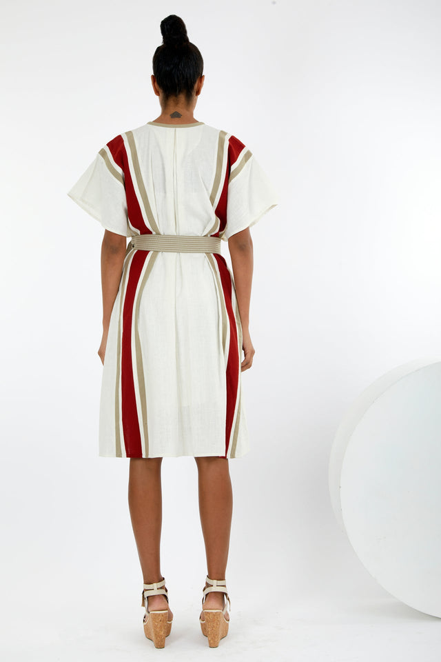 Fubu ivory kaftan dress back view showing the red and beige stripes and tied belt