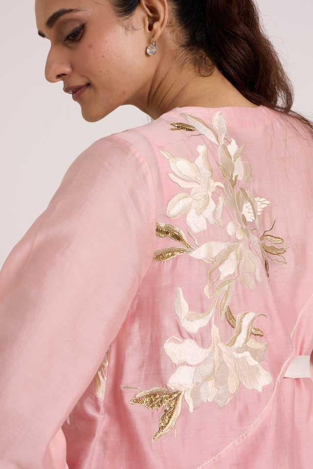 Close back view of the Hira-Jun jacket shoulder with ivory and gold floral applique