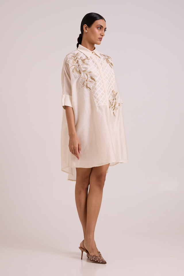 Mimi ivory framed shirt dress with rolled sleeves and high low hem, three quarter view