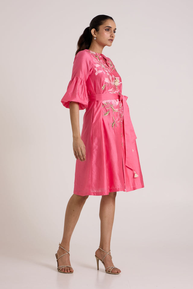 Jay pink Delphi midi dress with bell sleeves, three quarter view showing the belt tie