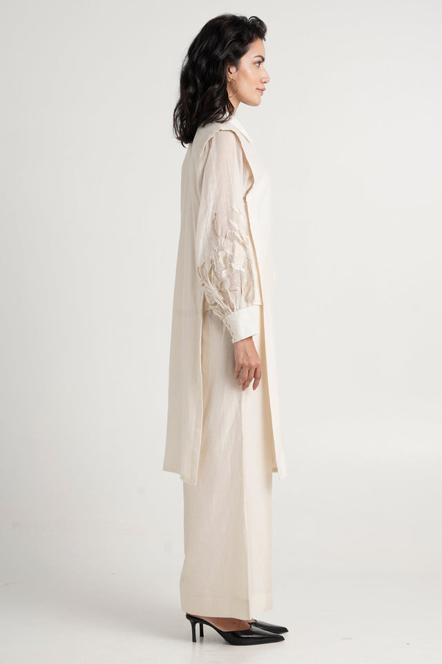 Buckler ivory kurta set side profile showing the long length and embroidered sleeve