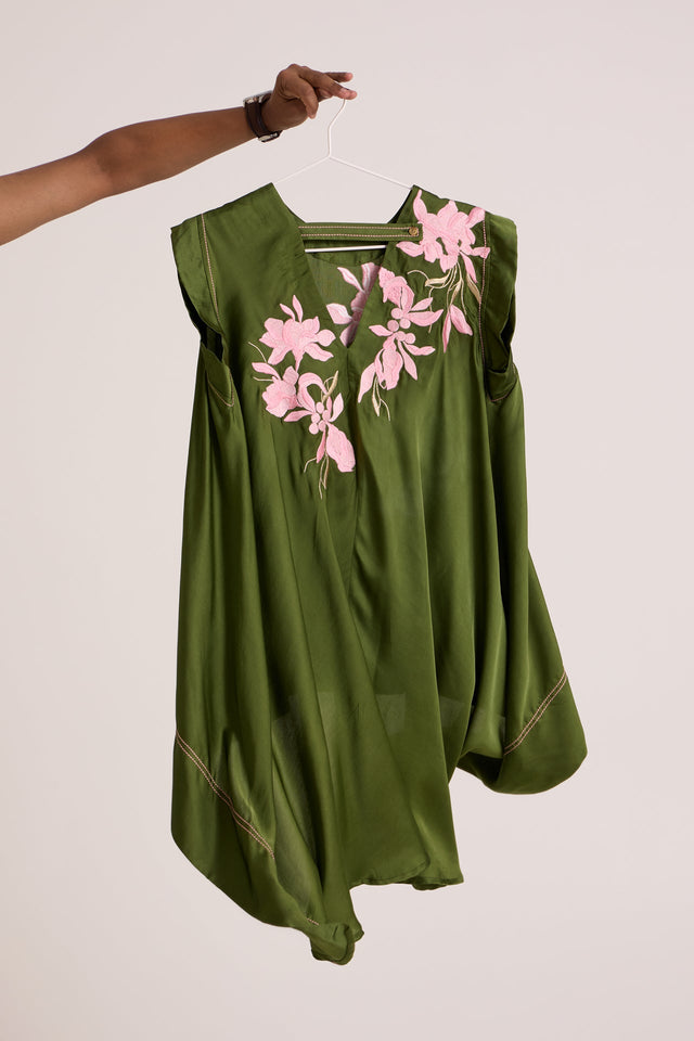 Olive Zuma trail top on a hanger, back view showing the V back and pink floral applique