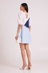 Juno short dress looking over the shoulder, back view showing the V back opening