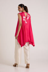 Jay pink Zuma fly high top looking over the shoulder, back view of the trailing hem
