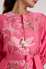 Close-up of the Delphi pink dress neck tie with ivory tassels and pink floral applique