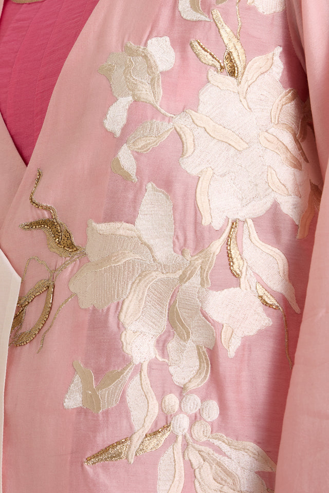 Close-up of the Hira-Jun jacket ivory floral applique with gold leaf details