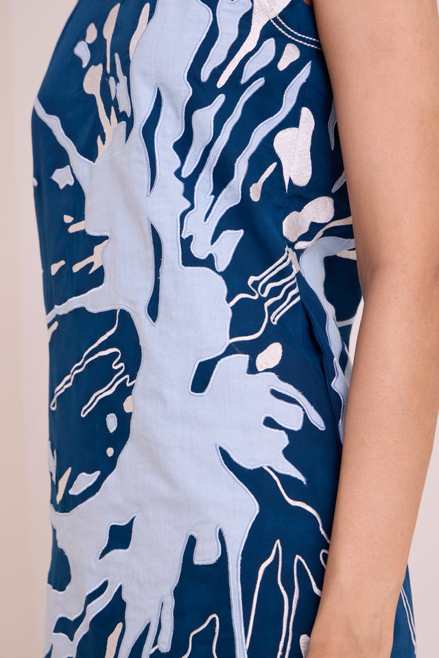 Close view of the Hudson frozen lake applique texture at the side of the dress