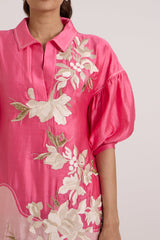 Close front view of the Avina collar and cascading ivory floral applique on hot pink