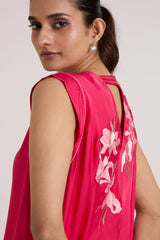 Close view of the Zuma pink top sleeveless shoulder and back keyhole with floral applique