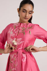 Close-up of the Delphi pink dress bodice with tassel tie, buttons and waist belt