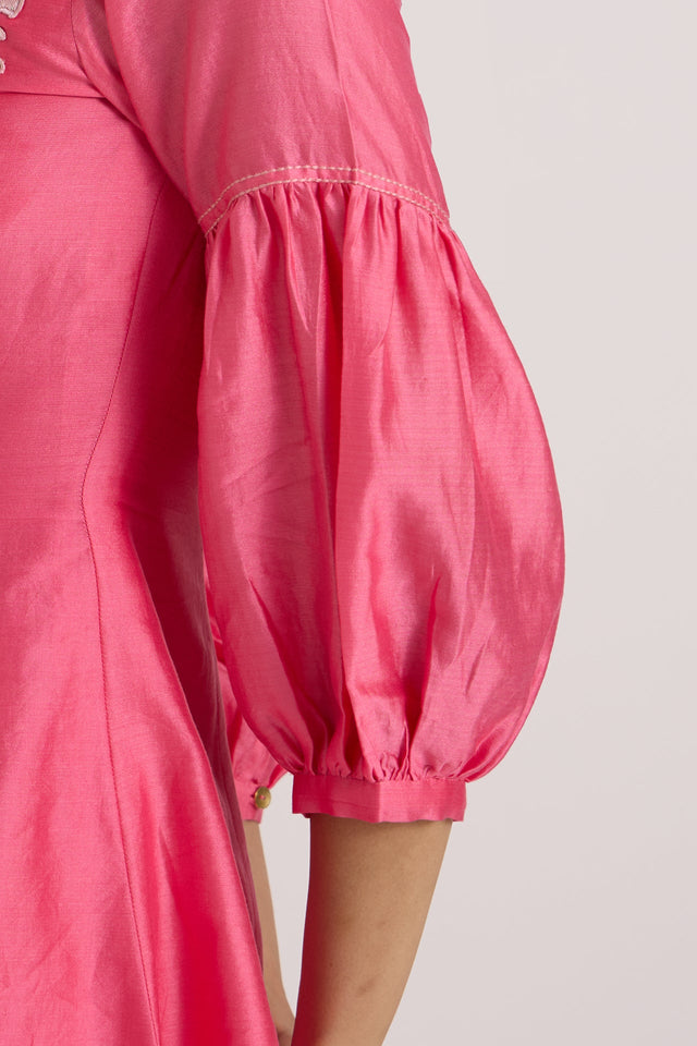 Close-up of the Velan pink top gathered puff sleeve with elastic cuff