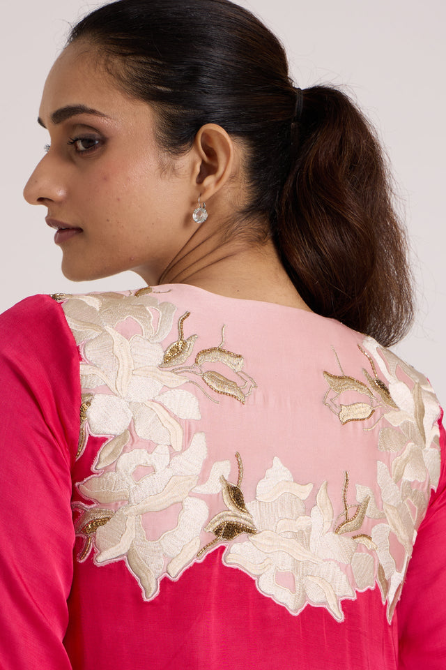 Close back view of the Cory dress blush yoke with layered ivory floral applique