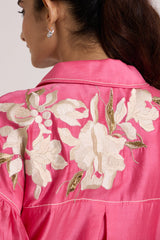 Close-up of the Avina midi dress back collar and ivory flowers across the shoulders