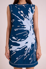 Close front view of the Hudson dress pale blue splash applique and topstitched hem