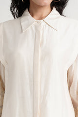 Close view of the Buckler ivory kurta pointed collar and concealed button placket