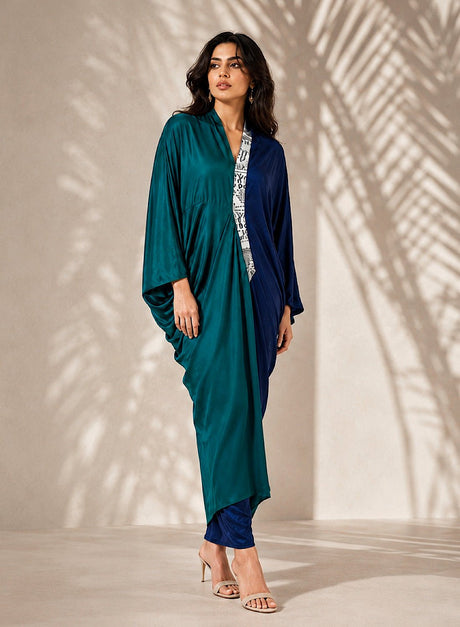 Model wearing the Dual Tone Kaftan, front view of the draped teal and blue sides