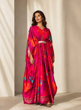 Model wearing the Fuschia Pink Kaftan, full length front view of the gathered waist