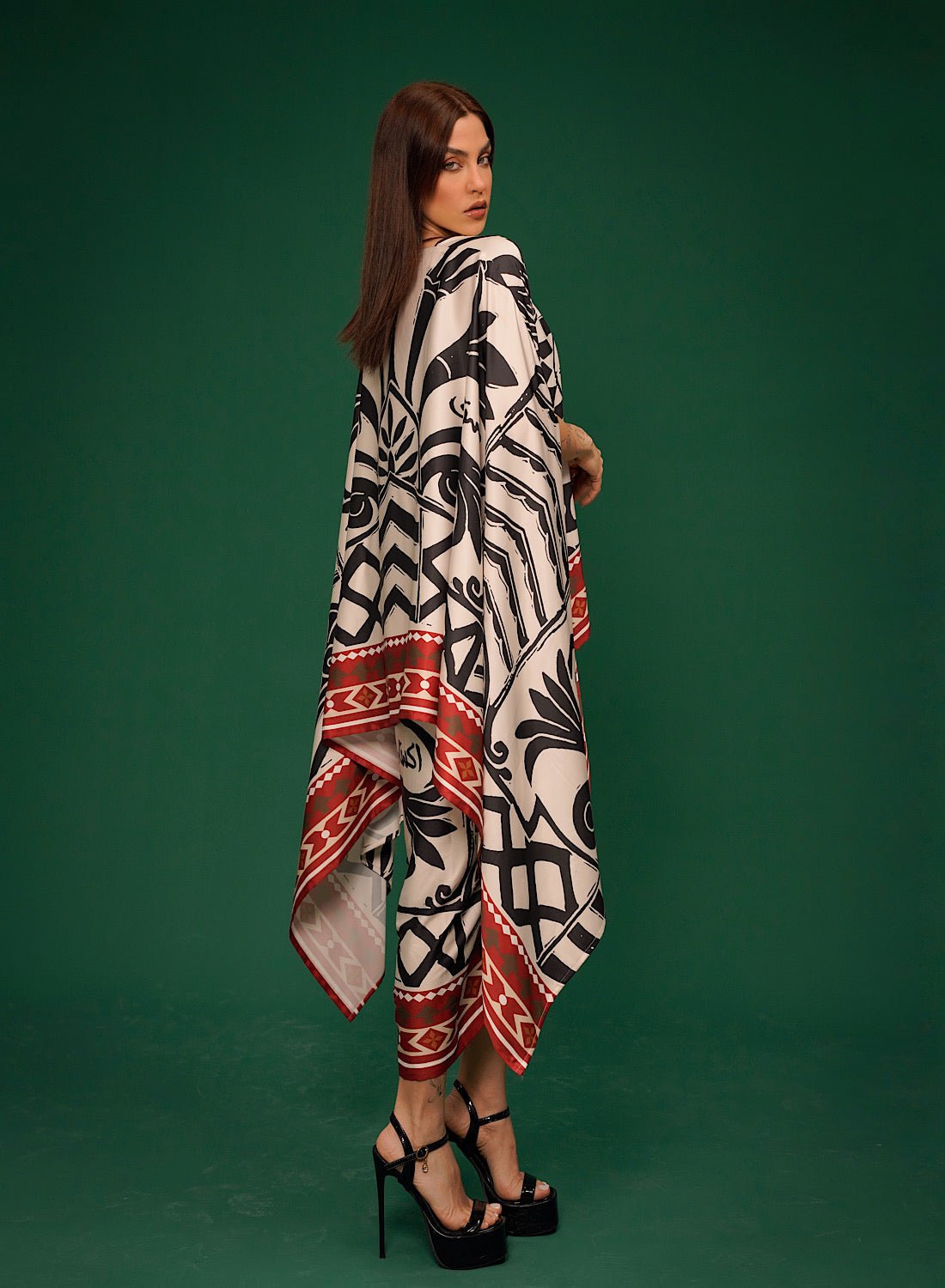 Harf Cape Set side view showing the red bordered cape and skirt