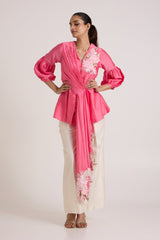 Jay pink Velan drop top with puff sleeves and hands on the waist, full length front view