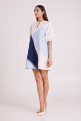 Juno short dress in white and blue panels, three quarter front view with pointed heels