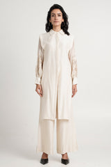 Buckler ivory kurta set with layered front panels and wide pants, straight front view