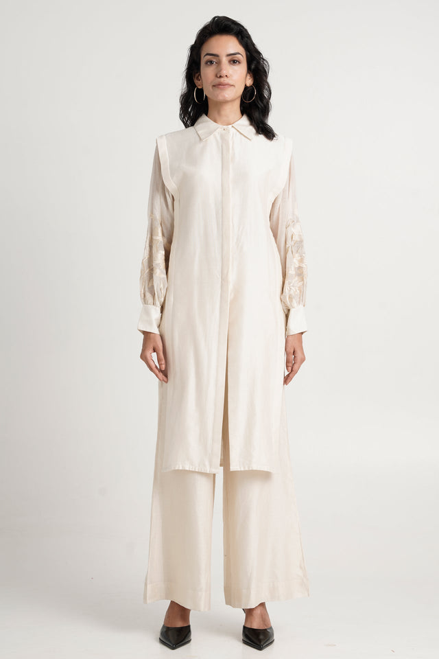 Buckler ivory kurta set with layered front panels and wide pants, straight front view