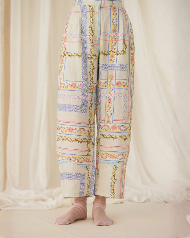 Ivory Ash Printed Pants with pastel patchwork print, back view