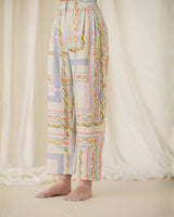 Close-up of the Ash Printed Pants lower legs showing the floral border print