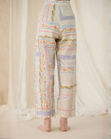 Ivory Ash Printed Pants with lilac and pink panel print, three quarter view