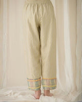 Pale sage Ash Tulip Pants with textured weave and tassel drawstring, side view