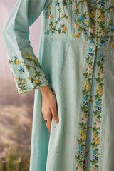 Close-up of the Azure Beaded Tunic floral embroidered placket and sleeve cuff