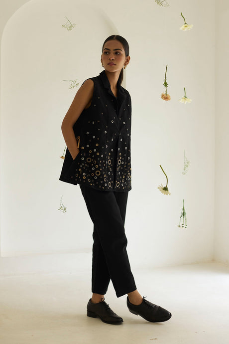 Model wearing the Black Denim Jacket with black pants, full length three quarter view