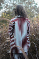 Burgundy and white striped Dusk Double-Buttoned Blazer, back view outdoors
