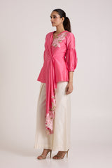 Jay pink Velan tiered drop top and ivory pants, three quarter side view of the drape