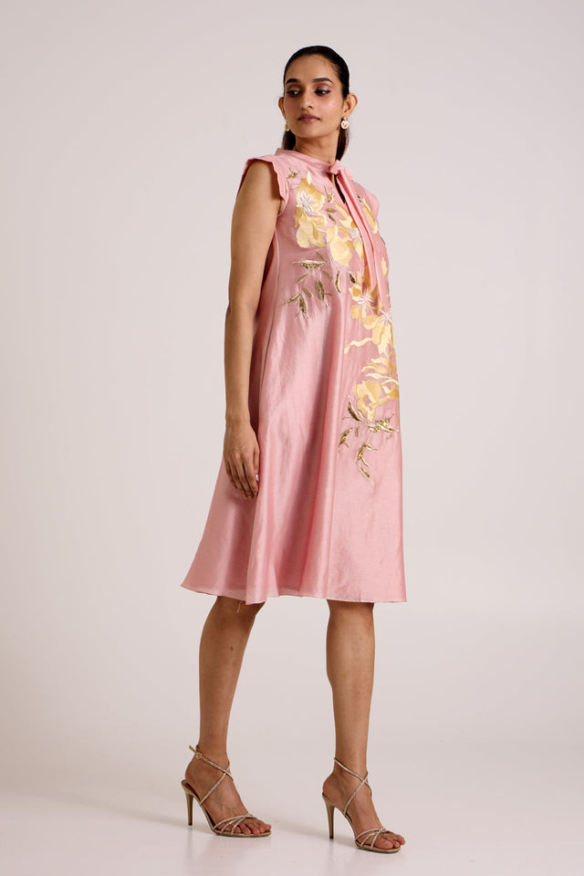 Ice pink Helga knee length dress with strappy heels, three quarter front view