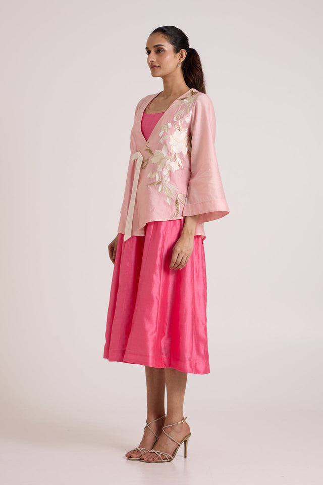 Jay pink Hira-Jun overlap jacket with ivory floral applique over the midi dress, three quarter view