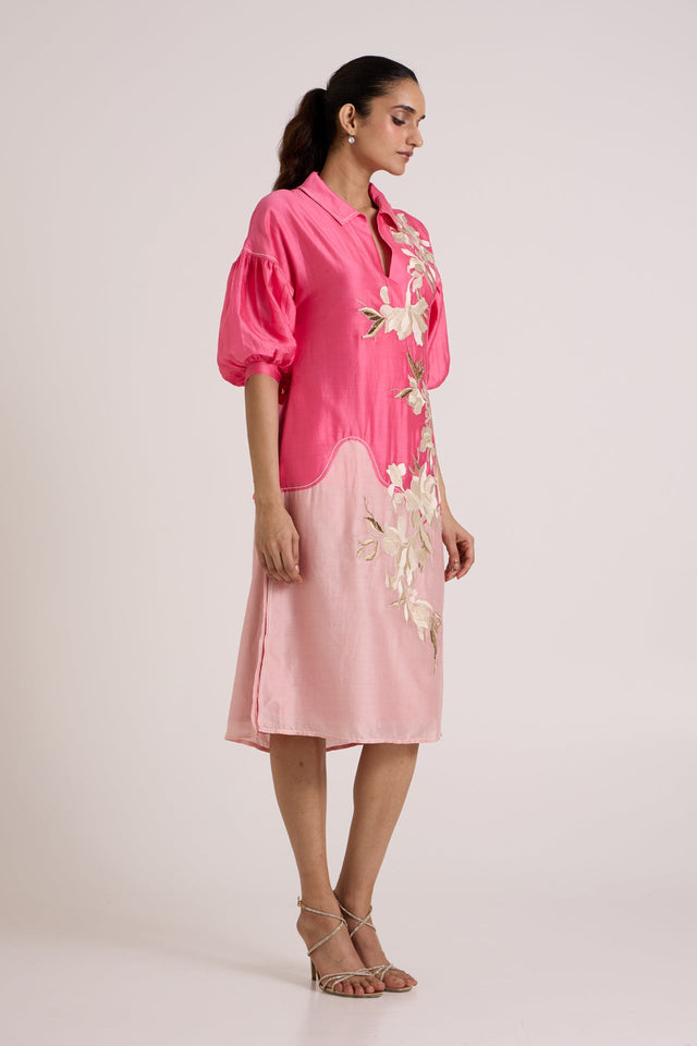 Jay pink Avina midi dress looking down, side view of the two tone skirt and puff sleeve