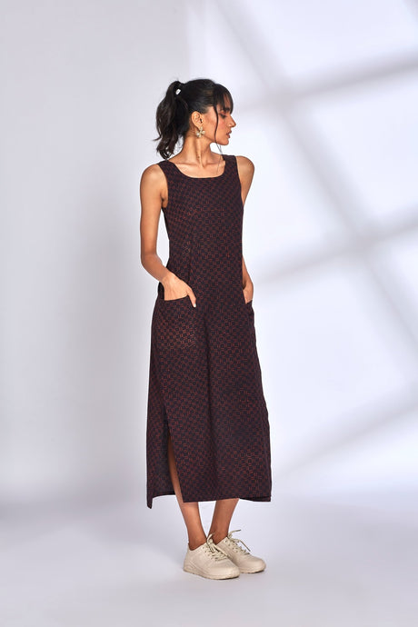 Aura Black Dress by Hasttvam, sleeveless black maxi with fine red block print, pockets and side slits, front view