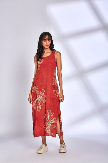 Model wearing the Aura Red Dress with cream florals and sneakers, three quarter view