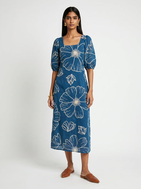 Ava Blue Cotton Dress by Hasttvam, blue midi with large cream floral print, square neck and puff sleeves, front view