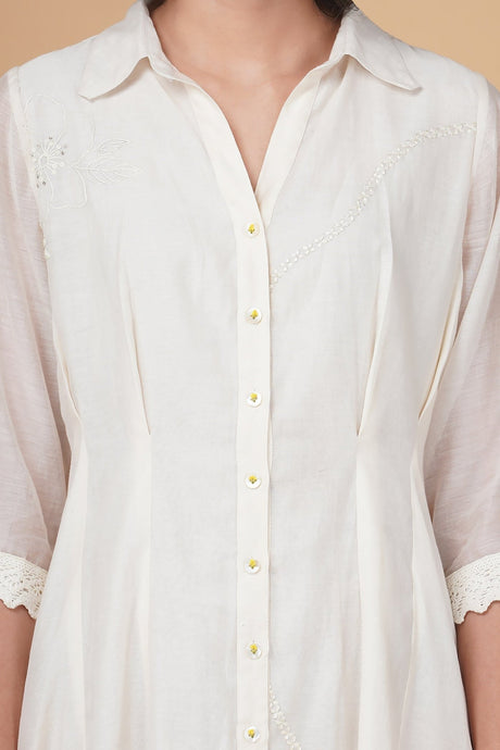 Close-up of the white Azisai Dress collar, button placket and tonal embroidery on the bodice