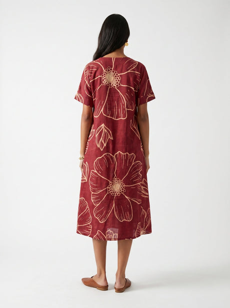 Back view of the Bea Red Modal Dress with round neck and cream floral print