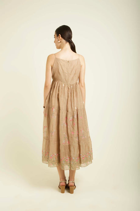 Beige Mul Chanderi Tier Dress without jacket, back view showing tiered skirt and embroidered hem