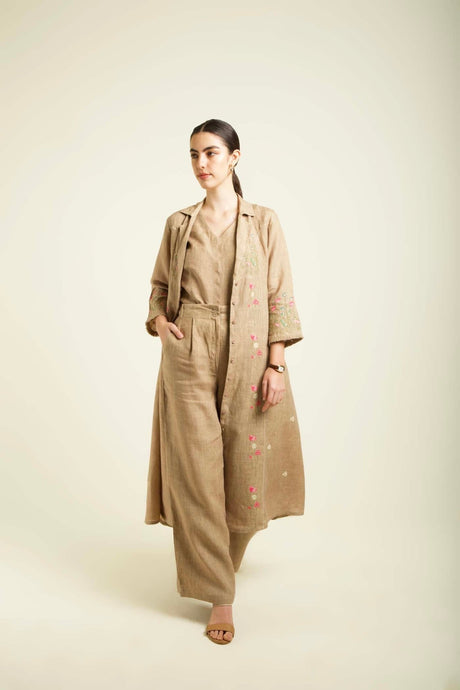 Model wearing the beige Linen Printed Jacket with hand in pocket, three quarter view