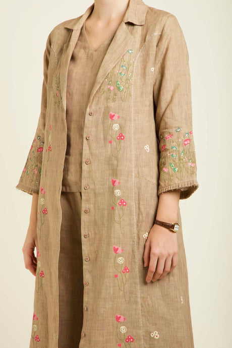 Close-up of the beige Linen Printed Jacket lapel and sleeve with pink and green floral print