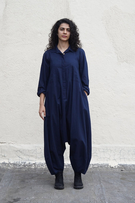 Front view of the blue collar sleeve Suga jumpsuit with long sleeves and balloon legs