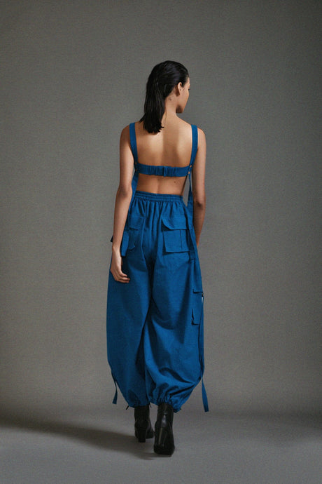 Back view of the Blue Pocket Corset showing the adjustable straps and elasticated back band