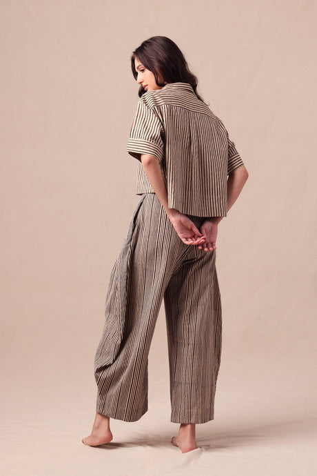 Charcoal Striped Barrel Pants with curved leg shape, three quarter back view