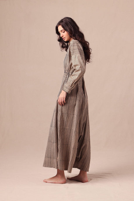 Side view of the Charcoal Striped Shirt Sphara Jumpsuit showing the relaxed wide leg silhouette